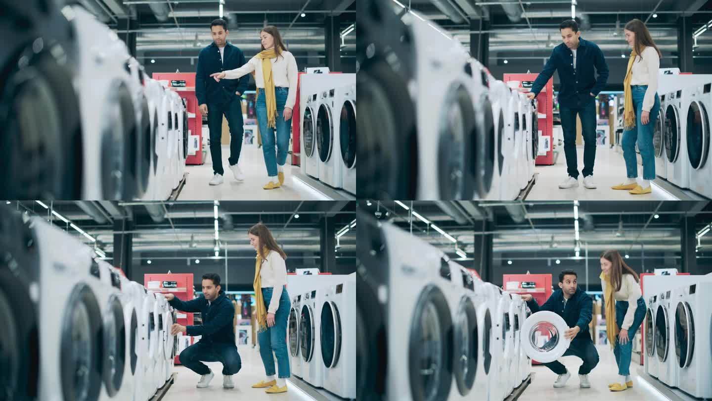 多元文化夫妇在家电商店评估洗衣机的选择。寻找可靠洗衣设备的男人和女人。顾客在零售商店探索现代洗衣解决