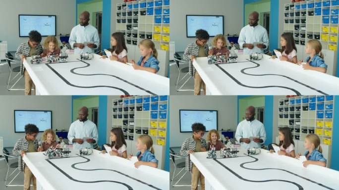 不同的孩子和老师测试电动机器人模型