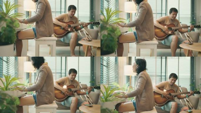 迷人的亚洲残疾夫妇在家里一起弹吉他和钢琴。冷静的态度。积极情绪。残疾人。