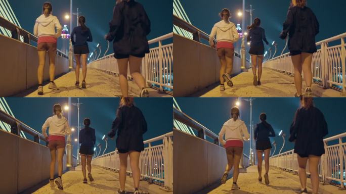 多种族团队年轻的亚洲运动女性穿着运动服，晚上在城市街道上的桥上跑步，享受有氧运动。参加跑步俱乐部和户