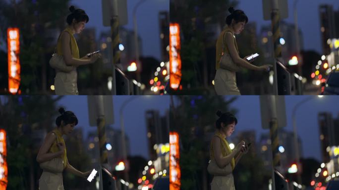 夜间，一名亚洲女性在城市里用手机支付停车费，她接受了数字钱包和多种支付方式的概念。