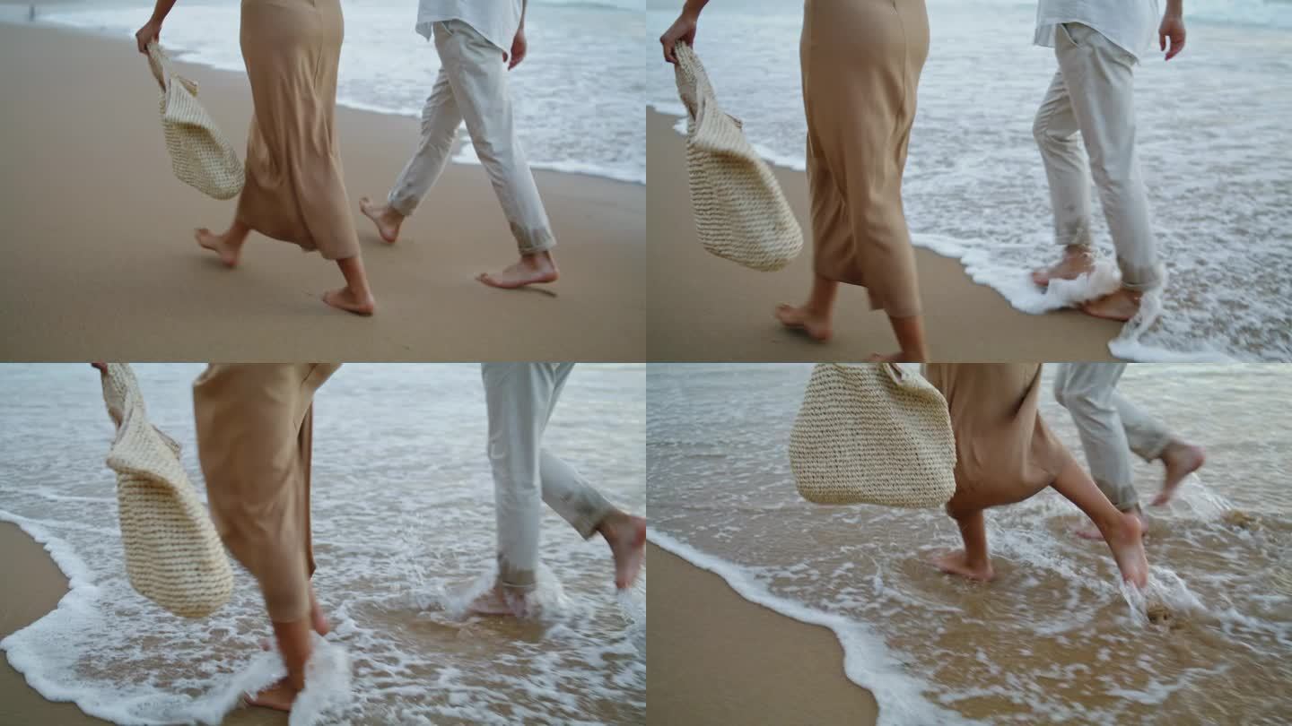 情侣的脚在沙滩上奔跑，在海边度假。一对在岸上散步的情侣