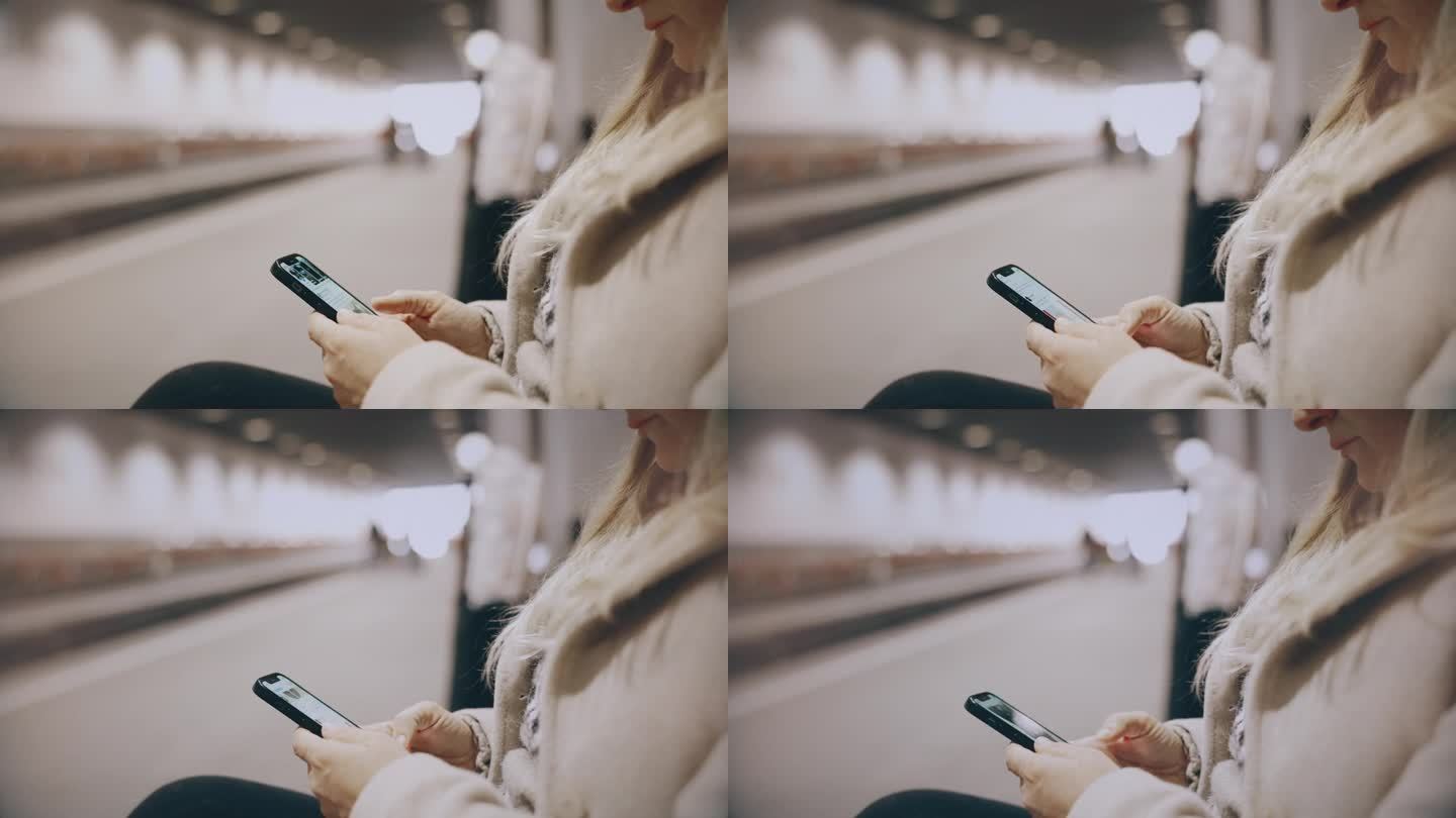 MS Woman在等火车的时候用她的智能手机