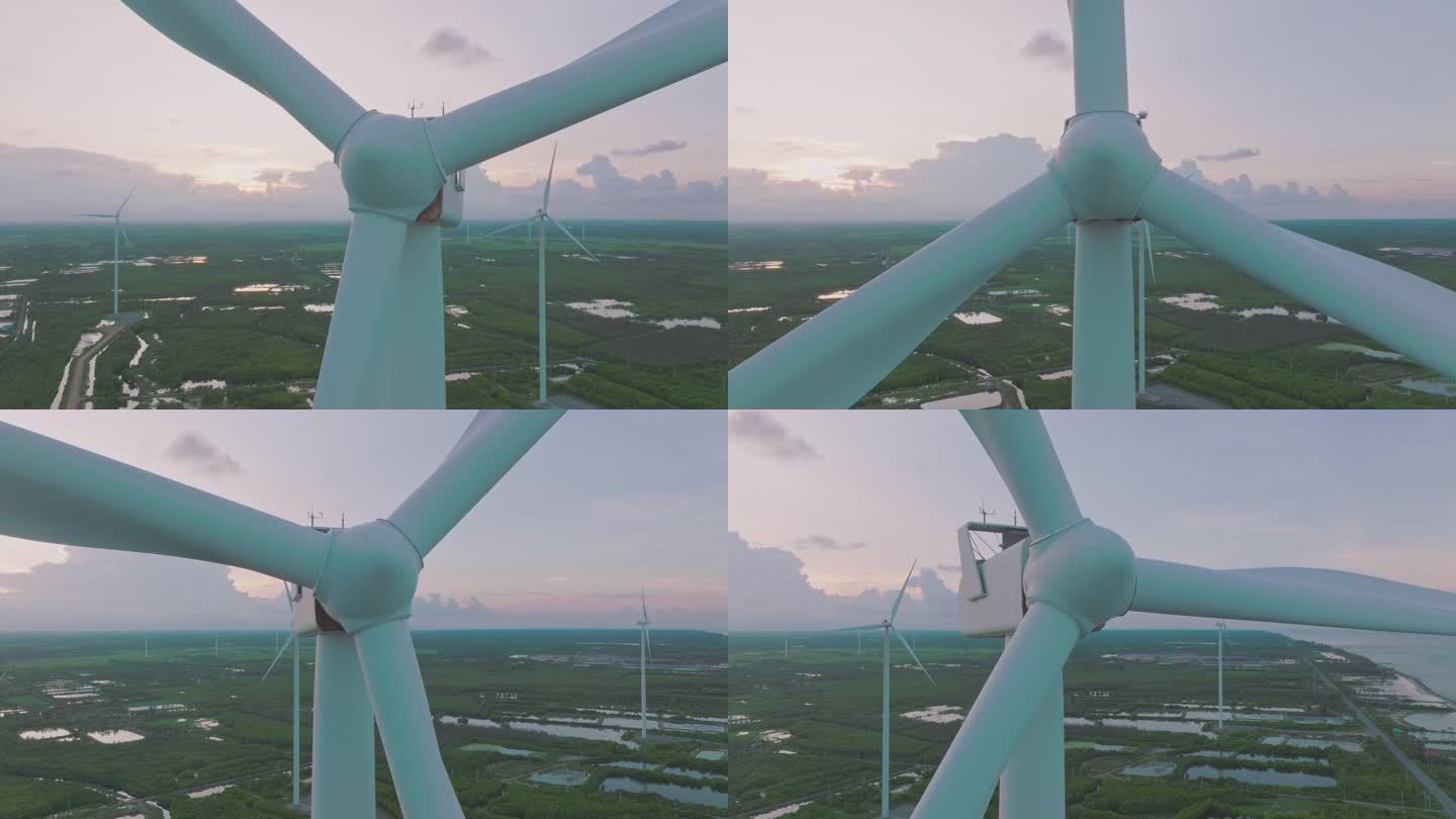 鸟瞰夕阳下的风力发电涡轮机。