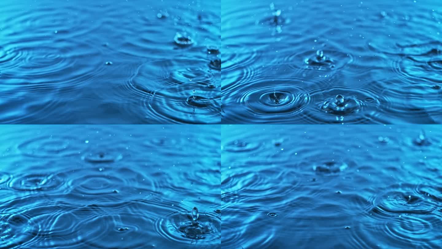 雨滴轻轻地落在蓝色的水面上