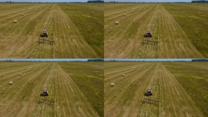 拖拉机使用干草烘箱快速烘干新割的草。用于加工草料的现代农用设备