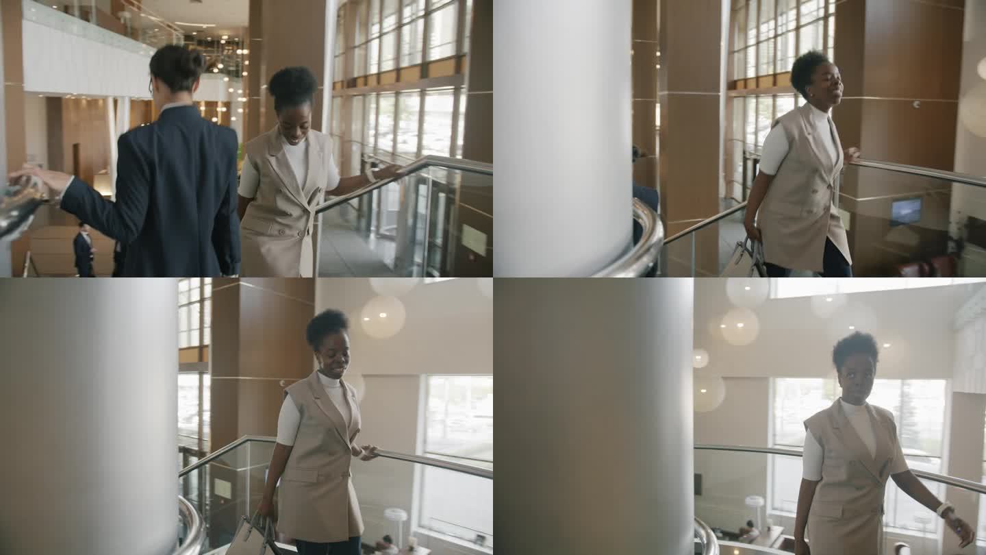 多莉拍摄的快乐的非洲裔美国女商人上楼在宽敞的豪华酒店