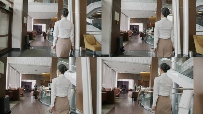 跟随年轻的中东女商人走在酒店大堂的镜头