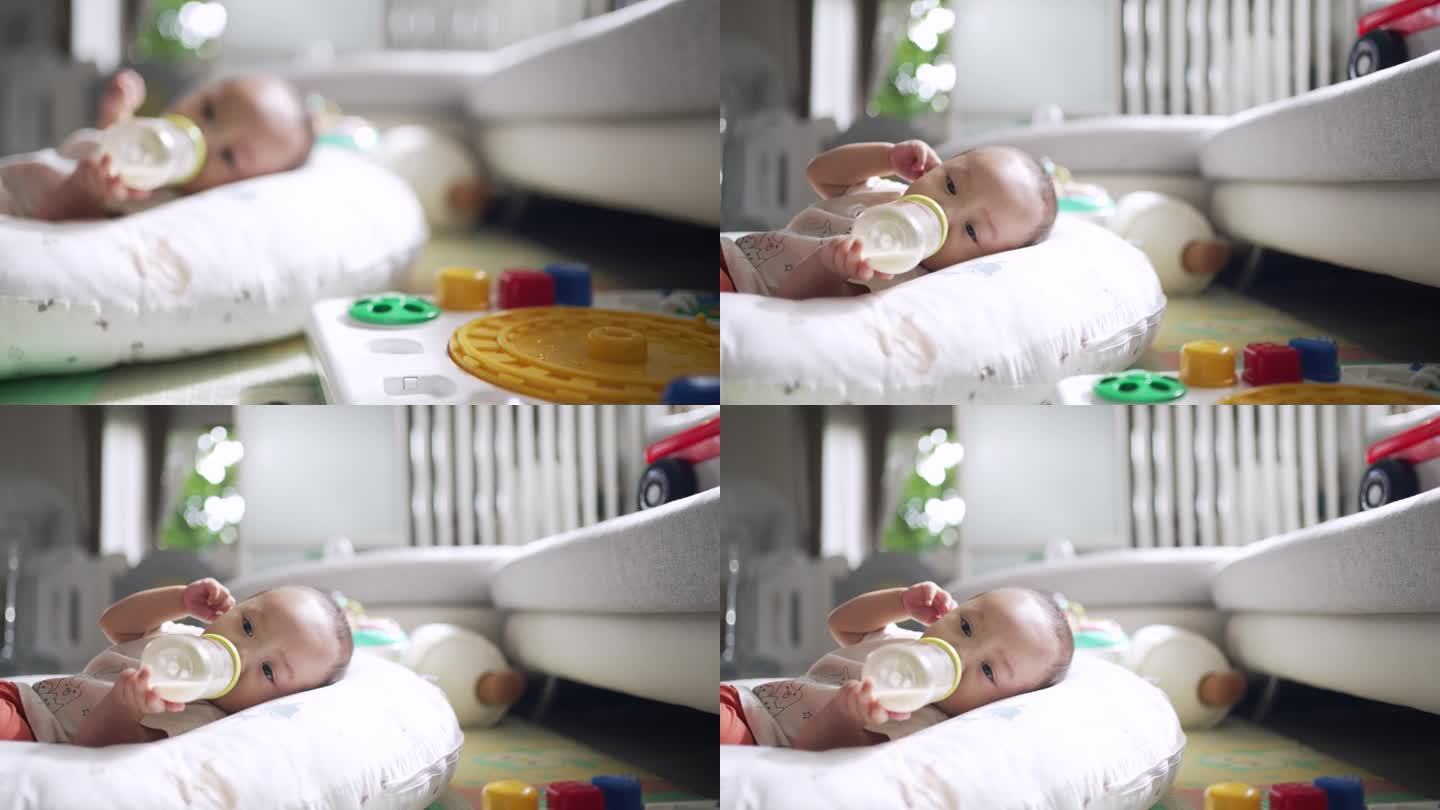 男孩在家里的婴儿床上自己喂奶