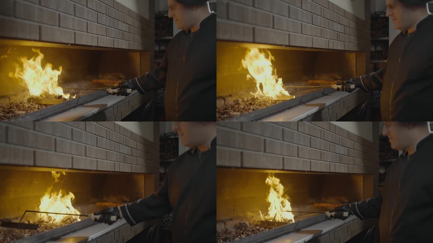 男厨师在烤架上点燃煤块。开火。烧炭火烧烤。慢动作