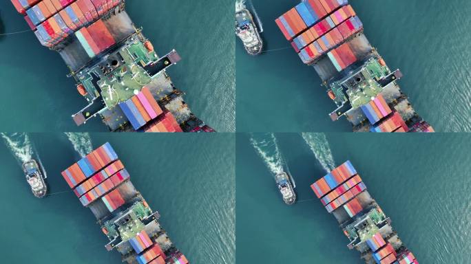 航拍的货船尾部视图，运载集装箱和拖船从货场港口出口货物到定制海洋概念货运船