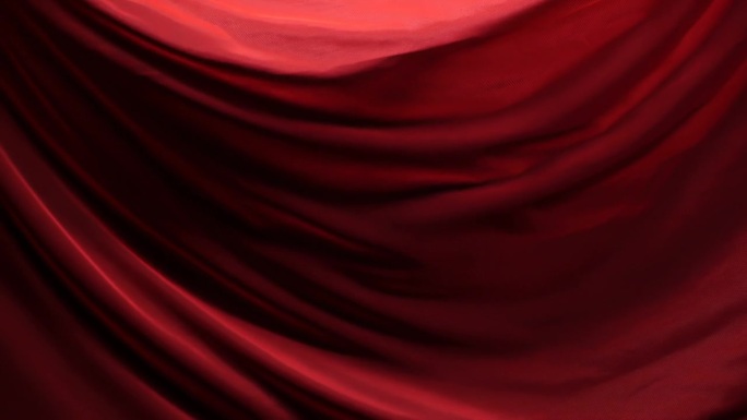 在戏剧性的灯光下，黑色背景上浅红色面料的移动褶皱的别致和优雅的纹理。慢动作200 FPS