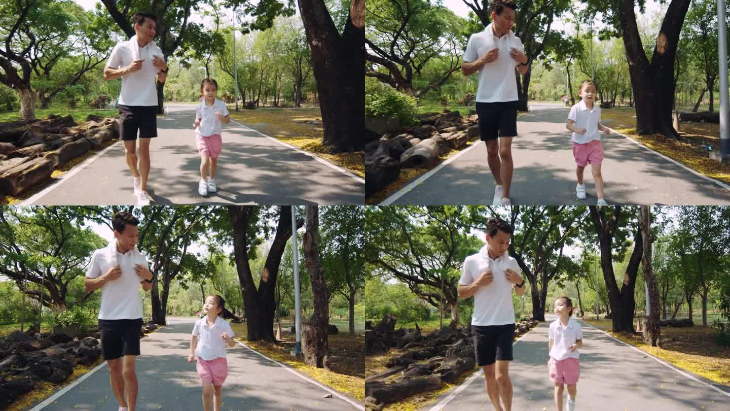 父亲和女儿在公园里锻炼