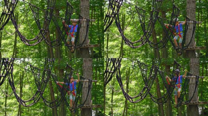 一个小男孩正在郁郁葱葱的森林里享受一场惊险刺激的绳索障碍赛。他戴着头盔，系着安全带，在充满挑战的赛道