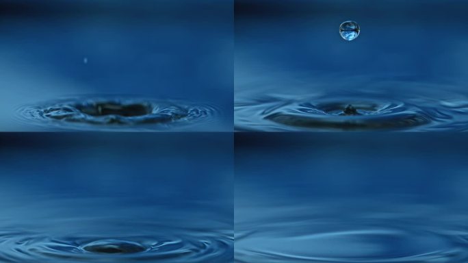水滴落入深蓝色的水中，在水面上反弹