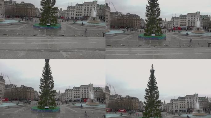 缓慢倾斜拍摄的伦敦圣诞树与英国纳尔逊的柱子完美排列