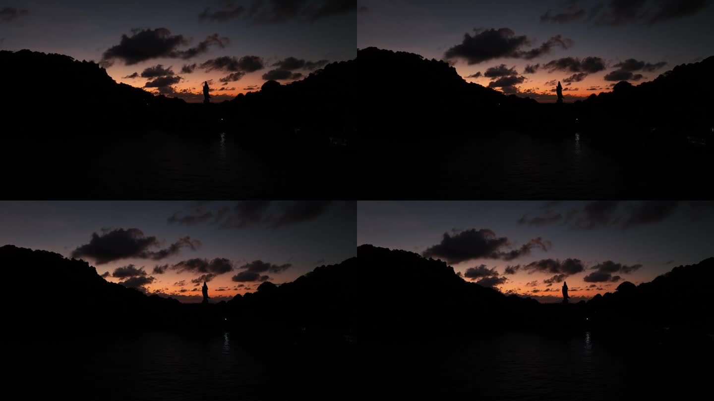 日出在Nghe岛与连珠塔和观音佛像面对大海，Kien jiang省