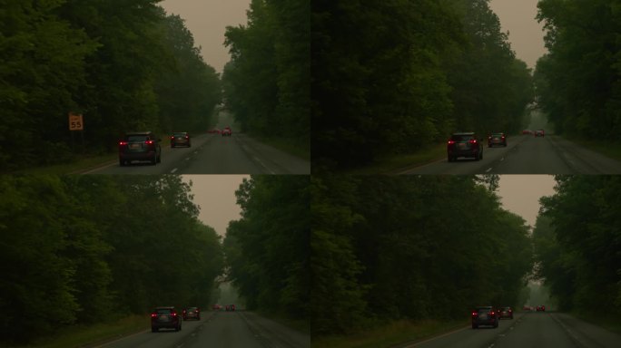 在马里兰州，烟雾弥漫的道路上，汽车驶向地平线。POV汽车驾驶