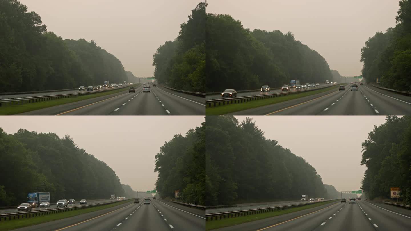 大火产生的烟雾遮住了迎面而来的车辆。巷道隐藏在热霾之下。驾驶板摄影机运动