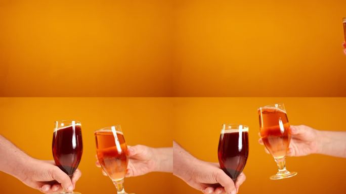 特写:男性和女性的手在缓慢的橙色背景下敬酒。特写:无法辨认的白人男女碰杯离开。