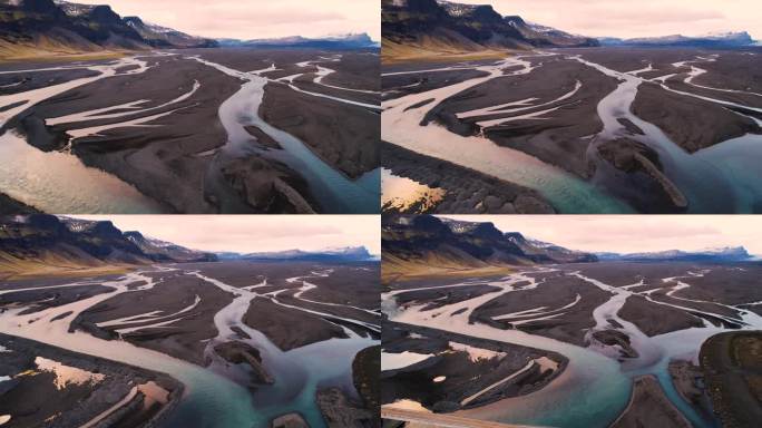 蓝色的河臂流经冰岛的熔岩沙