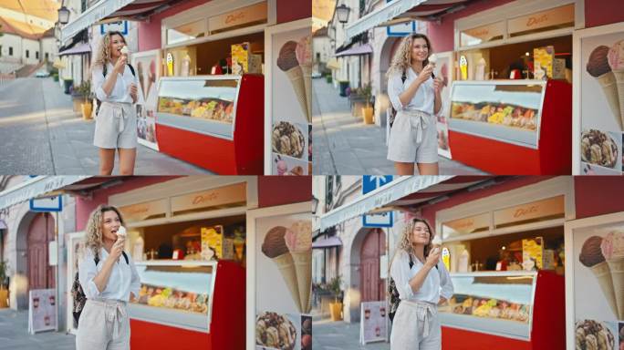 在Ptuj镇的一家商店外，快乐的年轻女子正在吃冰淇淋蛋筒