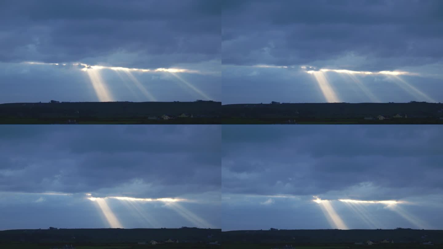 在一段延时视频中，太阳冲破云层，照亮了风景。以前灰暗阴沉的天空现在充满了光明。