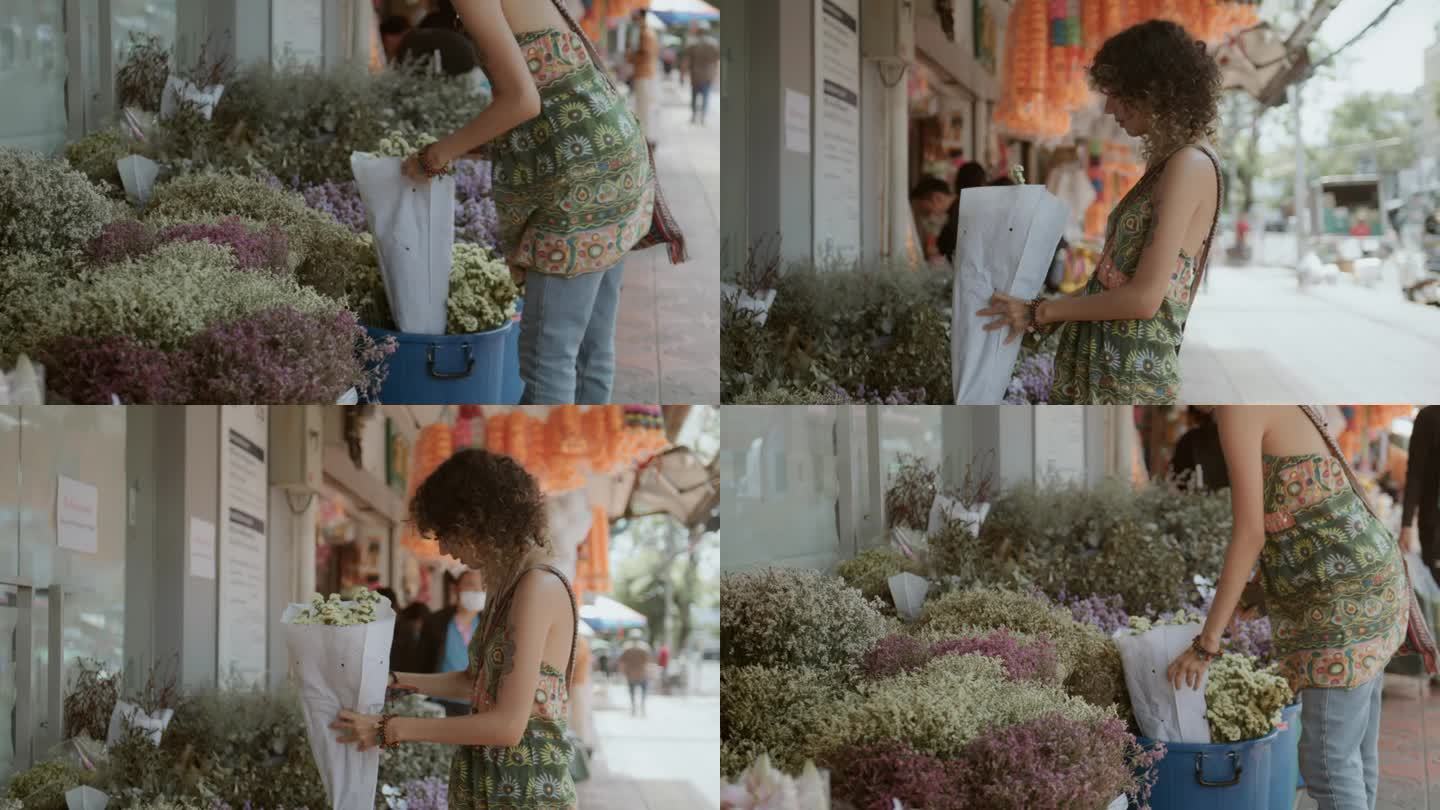 兴高采烈的游客在曼谷的花卉市场购买鲜花。