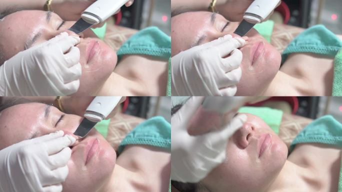 使用超声波洗肤器去除面部污垢和死皮细胞，在美容诊所，医学和美容皮肤科预约概念。