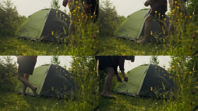 假期，两名游客在森林地区搭起帐篷，在山区健身过夜