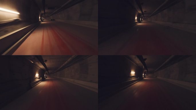 无人机飞行第一人称视角飞行通过一个黑暗的长隧道与道路