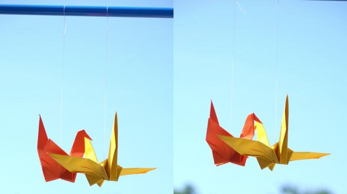2个折纸鸟挂得很漂亮。