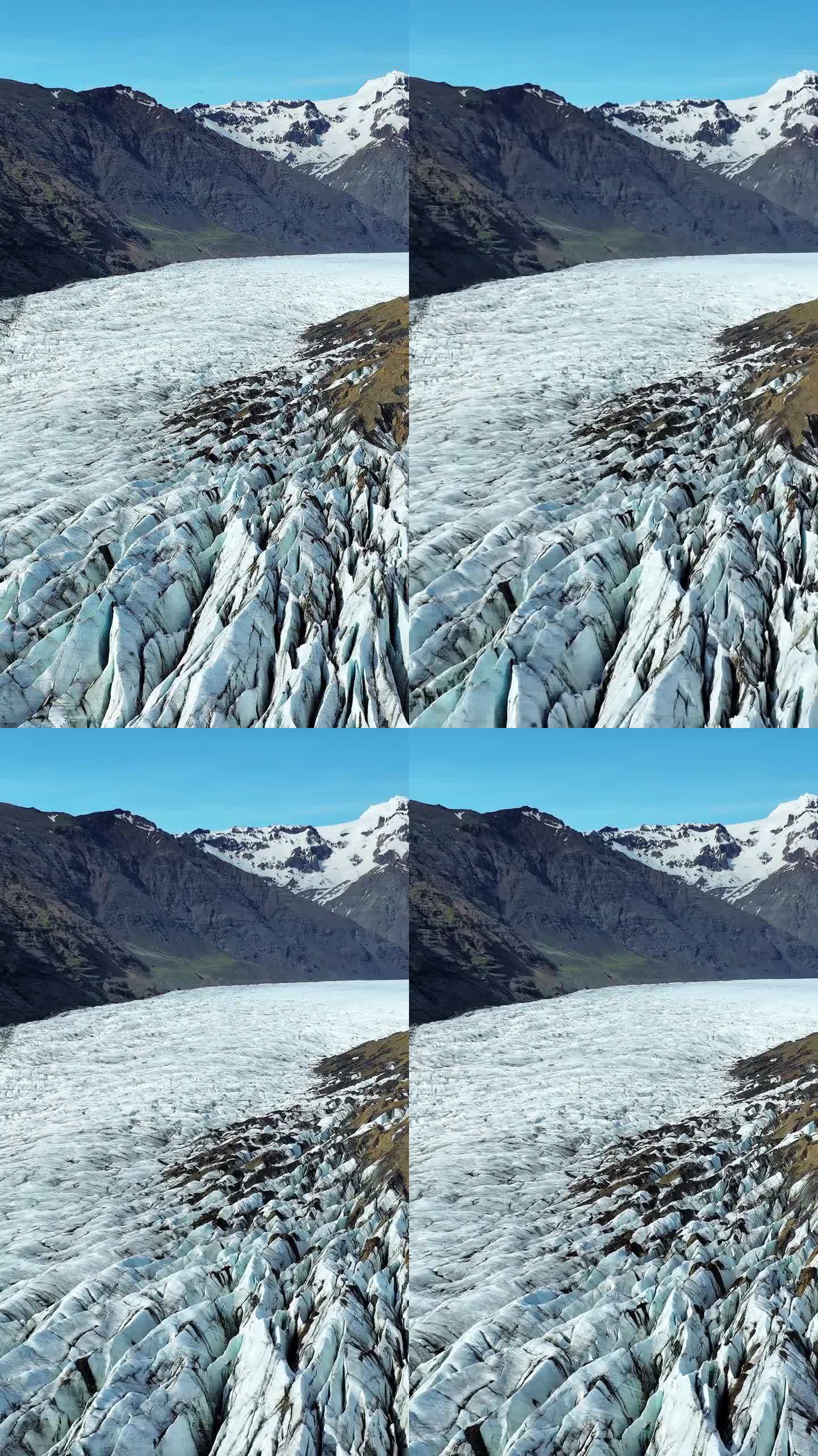 竖屏:冰岛的瓦特纳冰川。纯蓝冰，冬季景观鸟瞰图4k。欧洲最大的冰川。热门旅游景点，冰川融化。拍摄社交