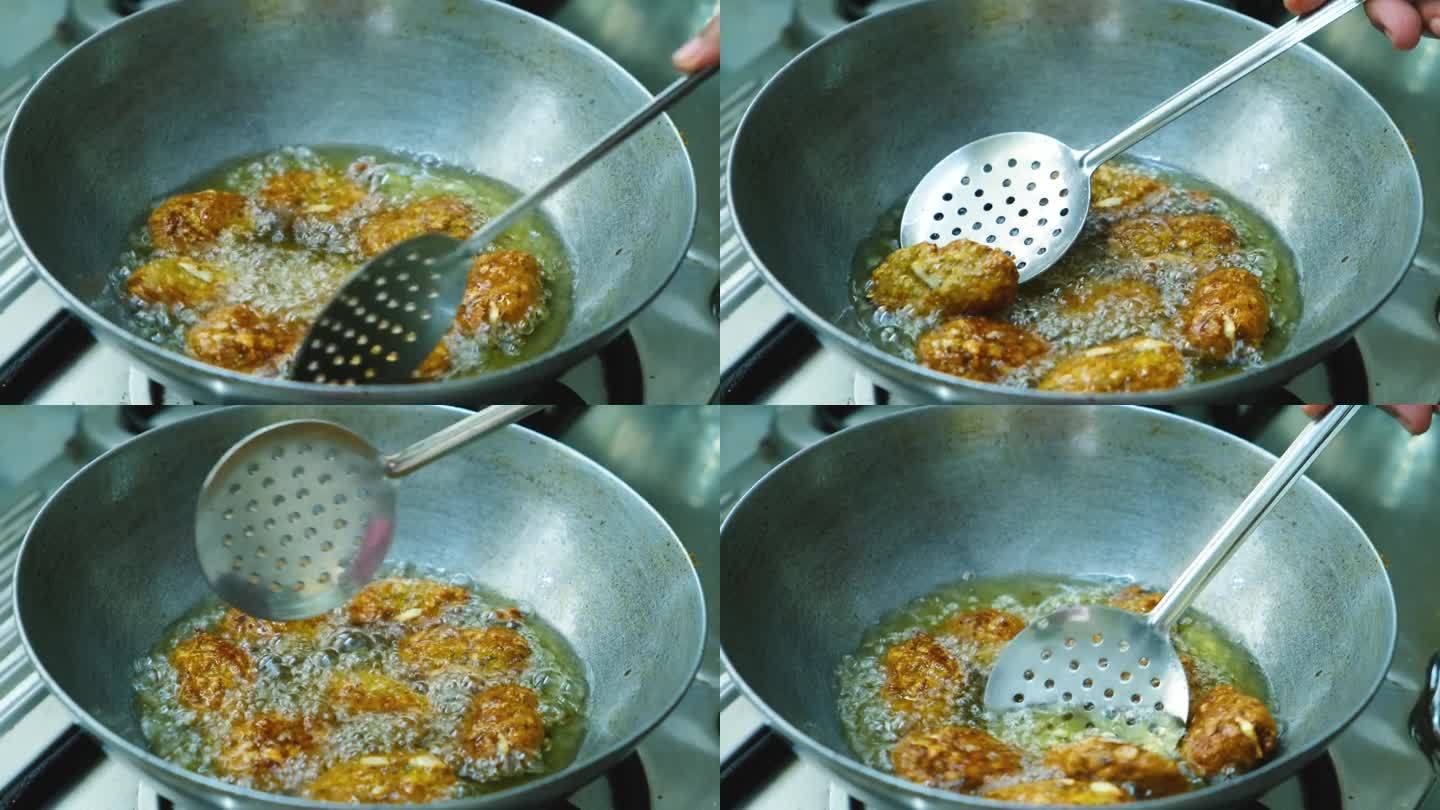 炸生印度煎蛋饼，在kadai的pakoda为蔬菜咖喱印度食品，4k镜头