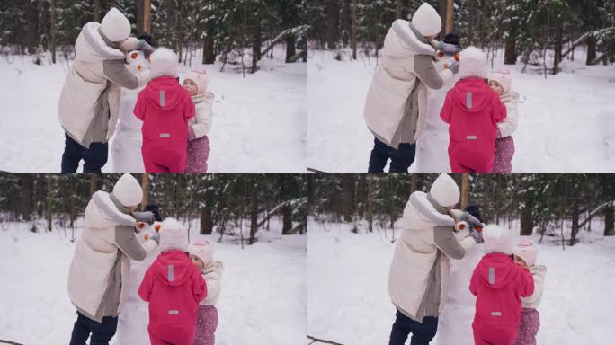 妈妈把目光从橘子转向雪人，她的女儿们帮助她。