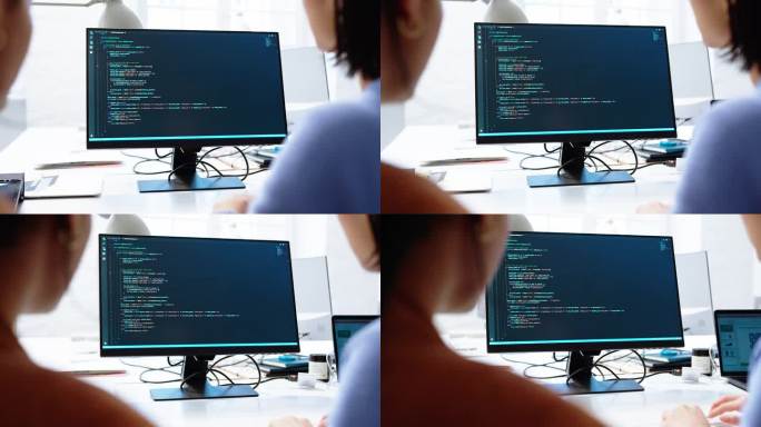 软件开发人员在联合办公的电脑屏幕上讨论代码
