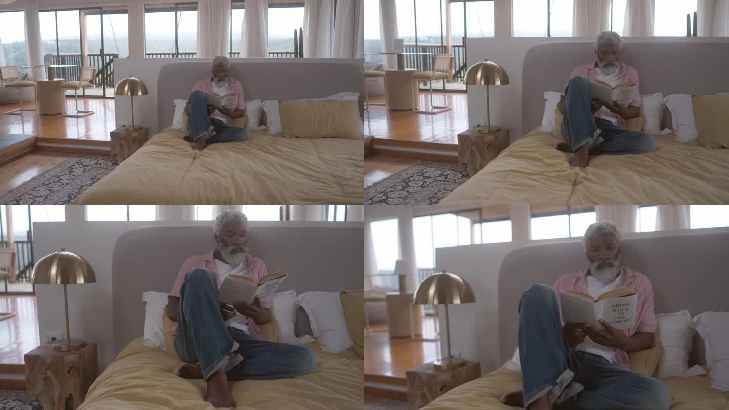 一个成熟的男人在家里躺在床上看书