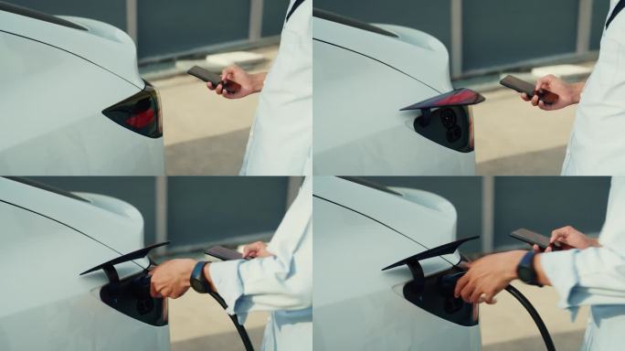 一个无法辨认的人正在用手将电动汽车插头插入汽车的进气口进行充电。