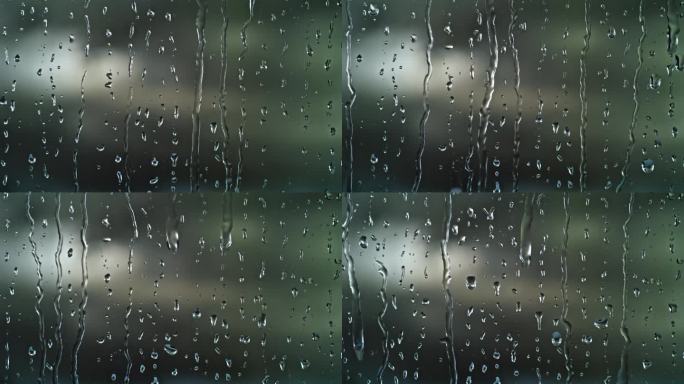 雨水打在窗户上水轨迹明亮背景雨天意象