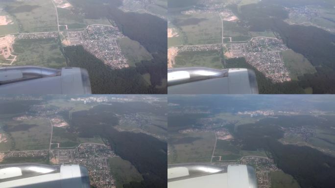 从飞机窗口看陆地坐飞机拍摄飞云之上