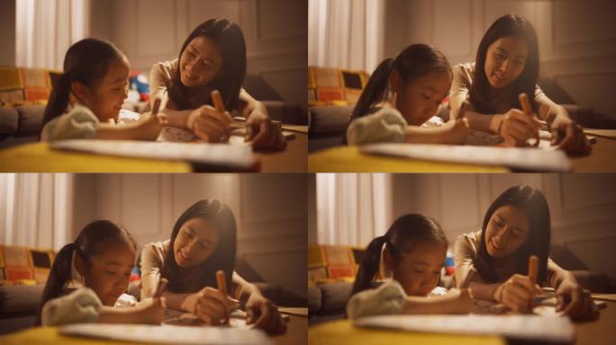 韩国母亲在家里的客厅里教女儿画画的照片。年轻女性在女儿很小的时候就支持她的创造力，与她建立联系，花时