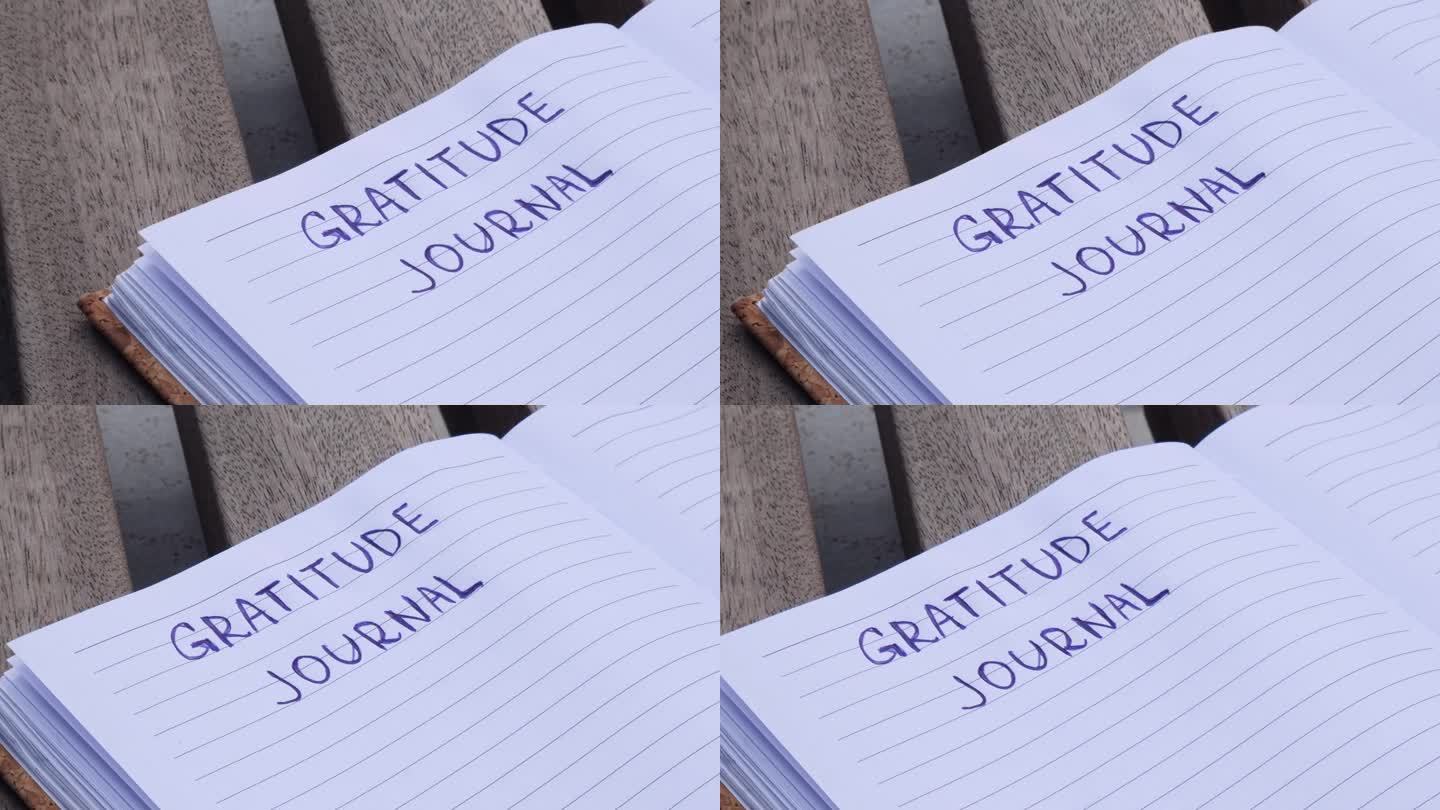 在木凳上写感恩日记。今天我心存感激。自我发现日志，自我反思创意写作，自我成长个人发展理念。幸福精神健