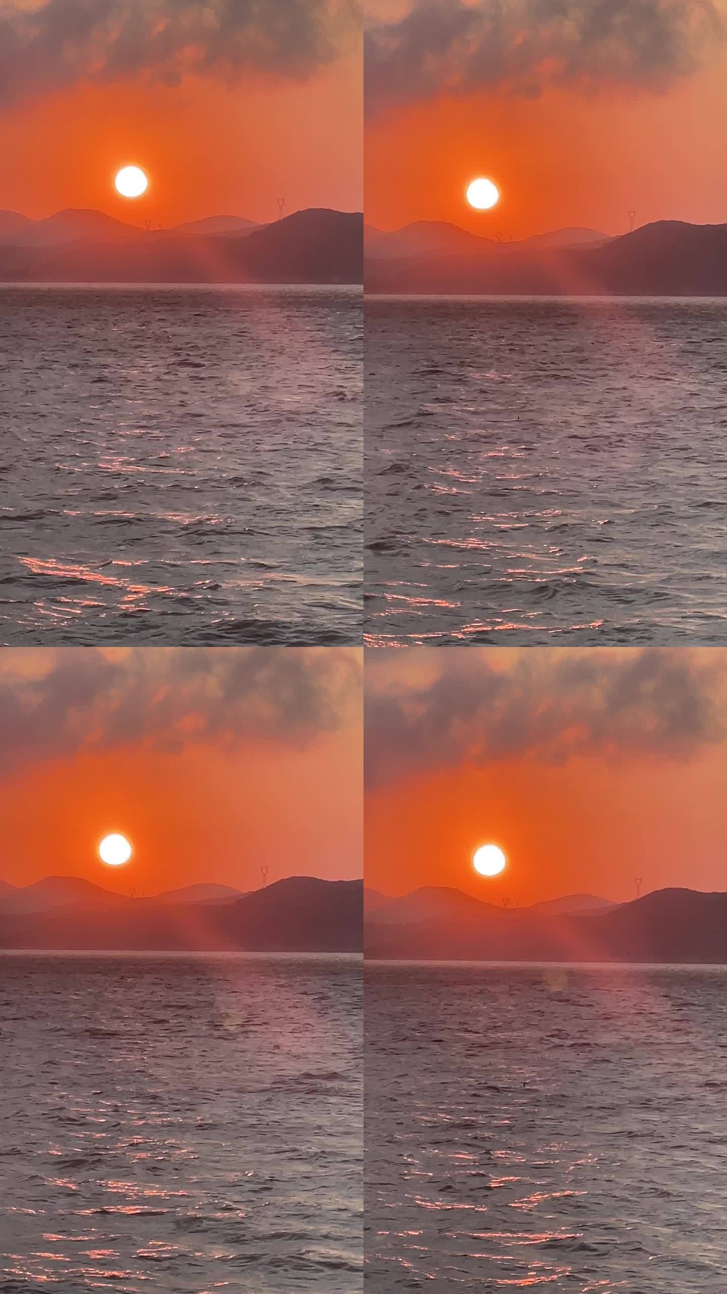 记录日落时分海面近光画面