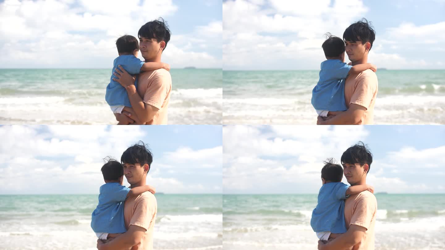 父亲和儿子在海滩上玩得很开心