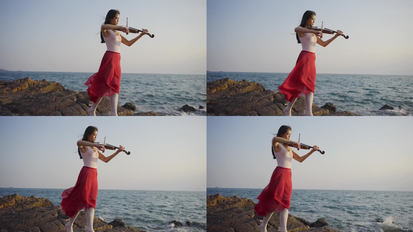 拉小提琴的漂亮女孩。
