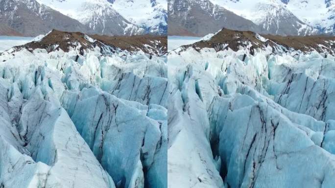 竖屏:冰岛的瓦特纳冰川。纯蓝冰，冬季景观鸟瞰图4k。欧洲最大的冰川。热门旅游景点，冰川融化。拍摄社交