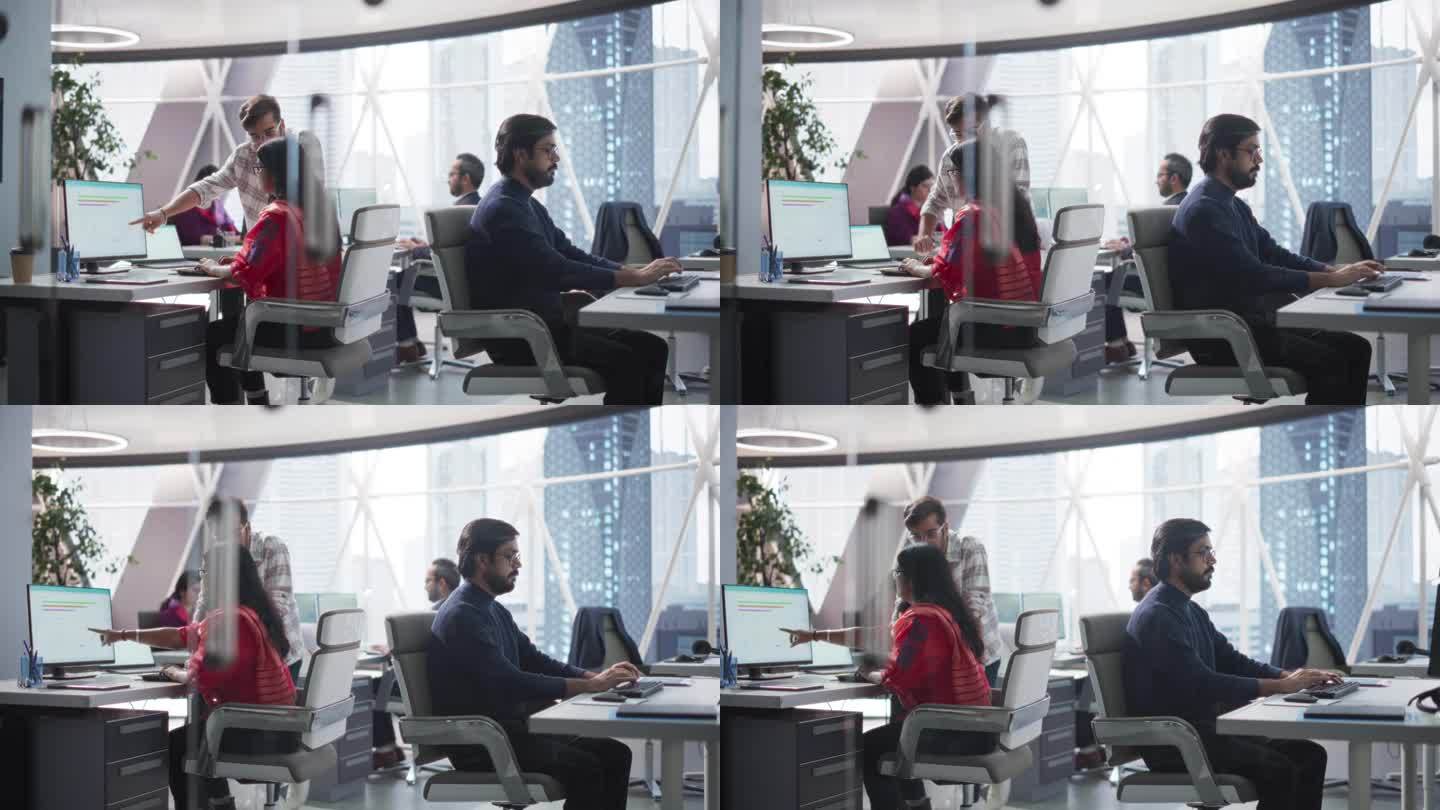 年轻的印度专家团队在电脑上工作，在办公室里聊天。男同事和女同事讨论他们的生成式人工智能项目的解决方案