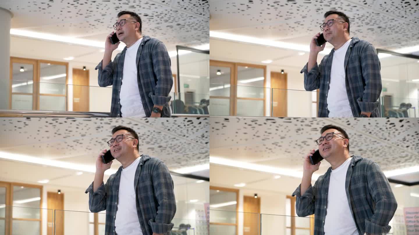 一位沉着的中亚企业家正在接听电话，在处理重要的商业事务时，流露出自信和专注
