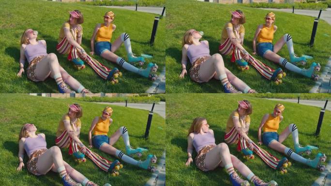 三个少女在公园的草地上休息