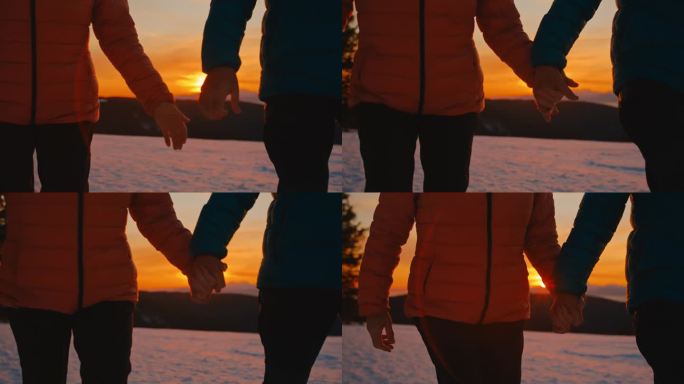 一对陌生的情侣在黄金时间漫步在雪地里，享受着深情的时刻